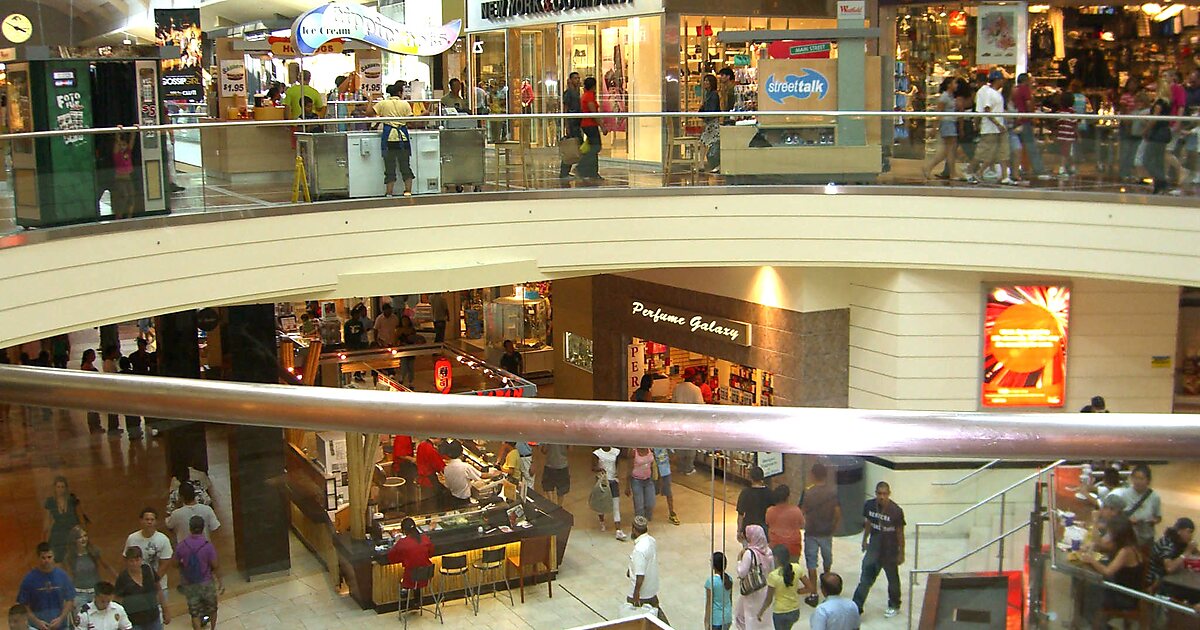 Shoppers walk through the Westfield Garden State Plaza mall on